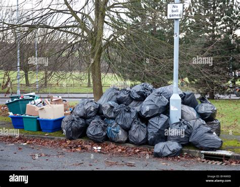 Piles Of Bin Bags And Recycling Boxes On A Street In Birmingham Uk