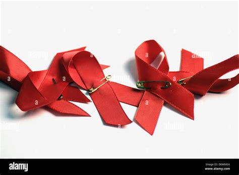 Red Ribbons Against Hiv Aids Stock Photo Alamy