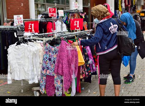 Shoppers Looking For Clothing At Birmingham Bullring Rag Market Uk